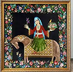 Tapis de couleur noire avec des motifs de fleurs et une cavalière