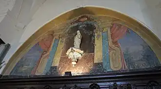 Vierge et arrière-plan peint sur bois.