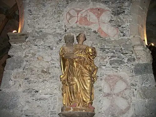 Sainte Barbe. Statue sculptée en bois et dorée (Environ  deux mètres de hauteur). Église Saint-Jean-Baptiste de Montréjeau