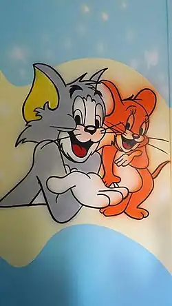 Peinture murale d'un intérieur avec Tom (à gauche) et Jerry la souris.