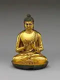 • Bouddha Vairocana.• Époque: Dynastie Tang VIIe – Xe&nbsp;siècle.• Bronze doré. Hauteur: 20,3 cm.• Metropolitan Museum of Art, New-York.