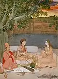 La dame assise sur une peau de lion skin, porte une large boucle d'oreille de la secte Kanphata (Nath yogi).