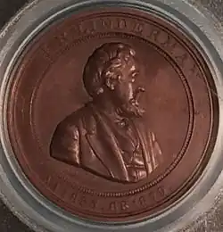Médaille représentant le buste d'un homme.
