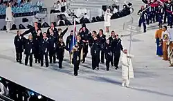 Photographie de l'entrée de la délégation néo-zélandaise lors de la cérémonie d'ouverture.