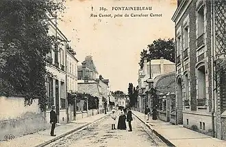 Carte postale représentant la rue Carnot depuis le carrefour Carnot — aujourd'hui place Milosz —, au tournant du XXe&nbsp;siècle