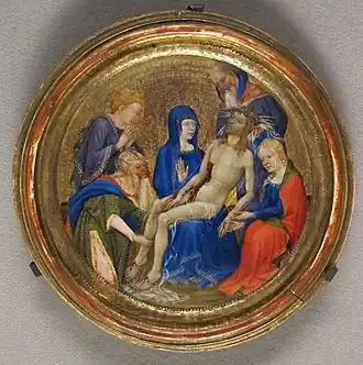 Petit tableau rond doré représentant le Christ porté par la Vierge et entourés de personnages