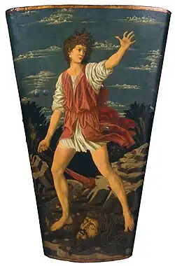 David tenant une fronde avec la tête de Goliath au sol