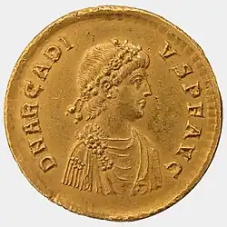 Avers d'une pièce de monnaie représentant le profil en buste d'un homme en toge et à la tête ceinte de lauriers.