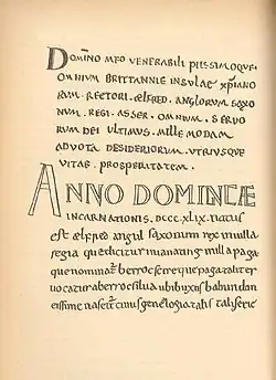 Une page manuscrite écrite en petites capitales, avec une grande inscription « Anno Dominicæ » au centre de la page