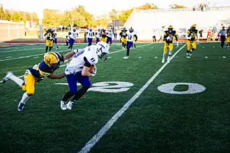 L'équipe de football américain contre les Lions de Texas A&M-Commerce&nbsp;(en) en 2014.