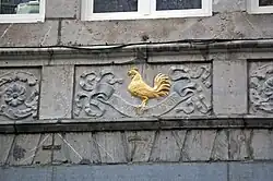 Enseigne « Au cocq d'or », au no&nbsp;25.