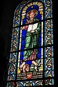 Vitrail du Christ portant les armoiries de l'architecte Abadie.