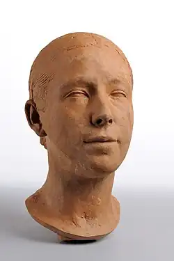 Tête de femme, terre cuite