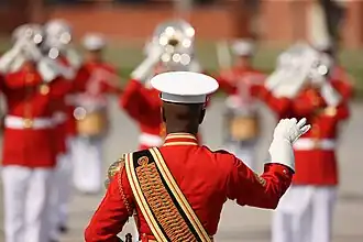 USMC Master Gunnery Sgt. leads the United States Marine Drum and Bugle Corps during a Battle Colors Ceremony