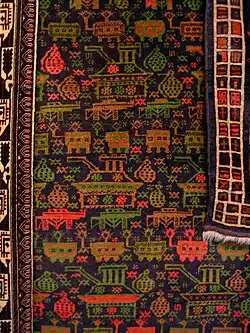 Tapis afghan à décor de chars, de grenades et de Kalachnikovs, Le Grand Jeu, coll. Michel Aubry, vu au musée de la tapisserie de Beauvais en 2012.