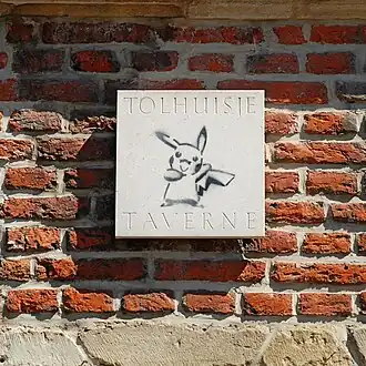 Enseigne de la taverne.