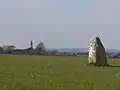 Le bourg et le menhir de la Roche au Diable.