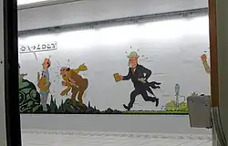Photographie d'une fresque dans une station de métro.