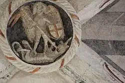 Clé de voûte représentant saint Michel terrassant le dragon.