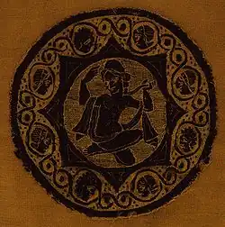 Aphrodite accroupie. Broderie en lin et laine. Égypte copte, IIIe – IVe&nbsp;siècle.