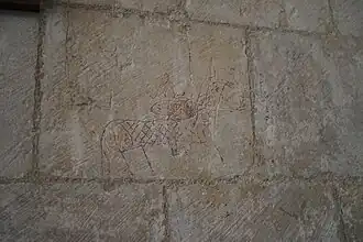 Gravure dans le mur de la nef.