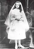 1907. Dina jour de sa première communion, le 2 mai.