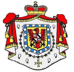 Armoiries des Fürstenberg : d'or, à la bordure nébulée d'argent sur azur, le champ ch. d'une aigle de gueules, becquée et membrée d'azur, ch. sur l'estomac d'un écusson écartelé : aux 1 et 4, de gueules, au gonfanon d'argent (Werdenberg); aux 2 et 3, d'argent, à la bande vivrée de sable (Heiligenberg)  Source: Rietstap.