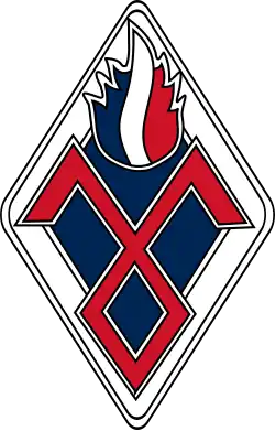 Losange dans lequel est inscrit le signe du parti surmonté d'une flamme tricolore.