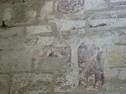 Fresque abîmée représentant des hommes, probablement des moines,