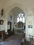 1re&nbsp;grande arcade du nord, vue dans le bas-côté.