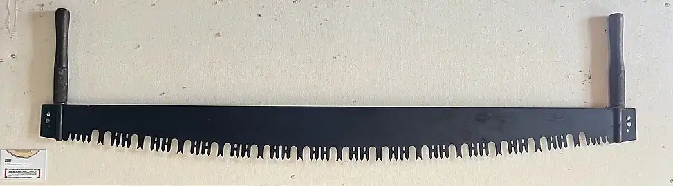 Godendart en usage au XXe&nbsp;siècle exposé au Moulin seigneurial de Pointe-du-Lac au Québec.