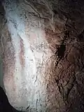 Gravures dans des cavités profondes et difficiles d'accès de la grotte du Moulin.