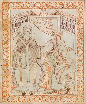 Dessin de style médiéval montrant deux hommes assis en habits de moines. L'un d'eux écrit sur un livre placé sur un pupitre.