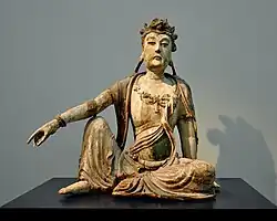 Bodhisattva Guanyin. Bois peint et doré. Jin, XIIe — XIIIe&nbsp;siècle Museum Rietberg, Zurich.