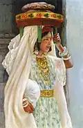 Henry d'Estienne ː Fille arabe portant du pain (vers 1900).