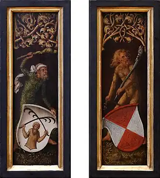 Miniature en couleurs : deux hommes nus et couverts de poils tiennent des massues. Un blason est posé devant chacun.
