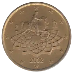 Pièce brune sur laquelle est gravé un homme sur son cheval.