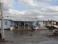 Maisons sur l'Isle à Jean Charles, endommagées par le passage d'un ouragan