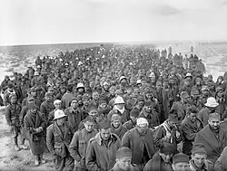A column of thousands of ragged looking men, stretching all the way to the horizon