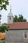 La chapelle Saint-Claude à Jougne Jura aux murs et clocher recouverts de tavaillons.