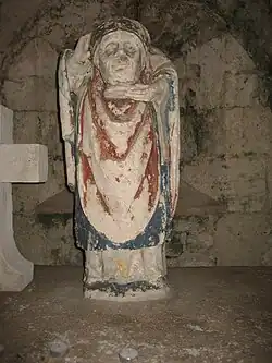 Statue polychrome de saint Denis, dans la crypte.
