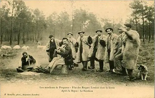 Bergers landais dansant le rondeau après leur repas au son de la boha.
