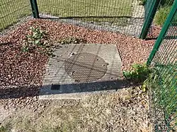 La tête de puits matérialisée.