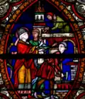 Un vitrail de la cathédrale de Lisieux figure l'évêque saint Patrice commandant un chantier d'église.