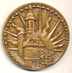 Médaille en bronze, 68&nbsp;mm, signée Laviolle, éditée pour le 4e&nbsp;centenaire de l'école, en 1962. Avers.
