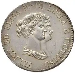 Face d'une pièce de monnaie ayant comme dessin deux visages