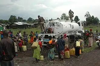 MONUSCO peacekeepers distributing drinking water, Rumangabo (10589770735).jpg