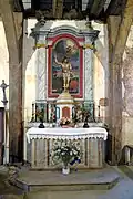 Maître-retable dédié à saint Sébastien déplacé pour l'ouverture des baies.