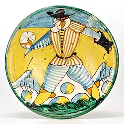 Assiette « Arlequin » avec la représentation d'un joueur de pallone, Montelupo Fiorentino, XVIIe&nbsp;siècle.