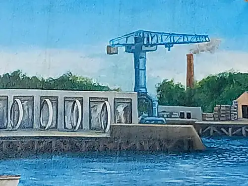 La grue grise, le hangar à bananes et les Anneaux de Buren représentés sur Le Mur tombé du ciel.